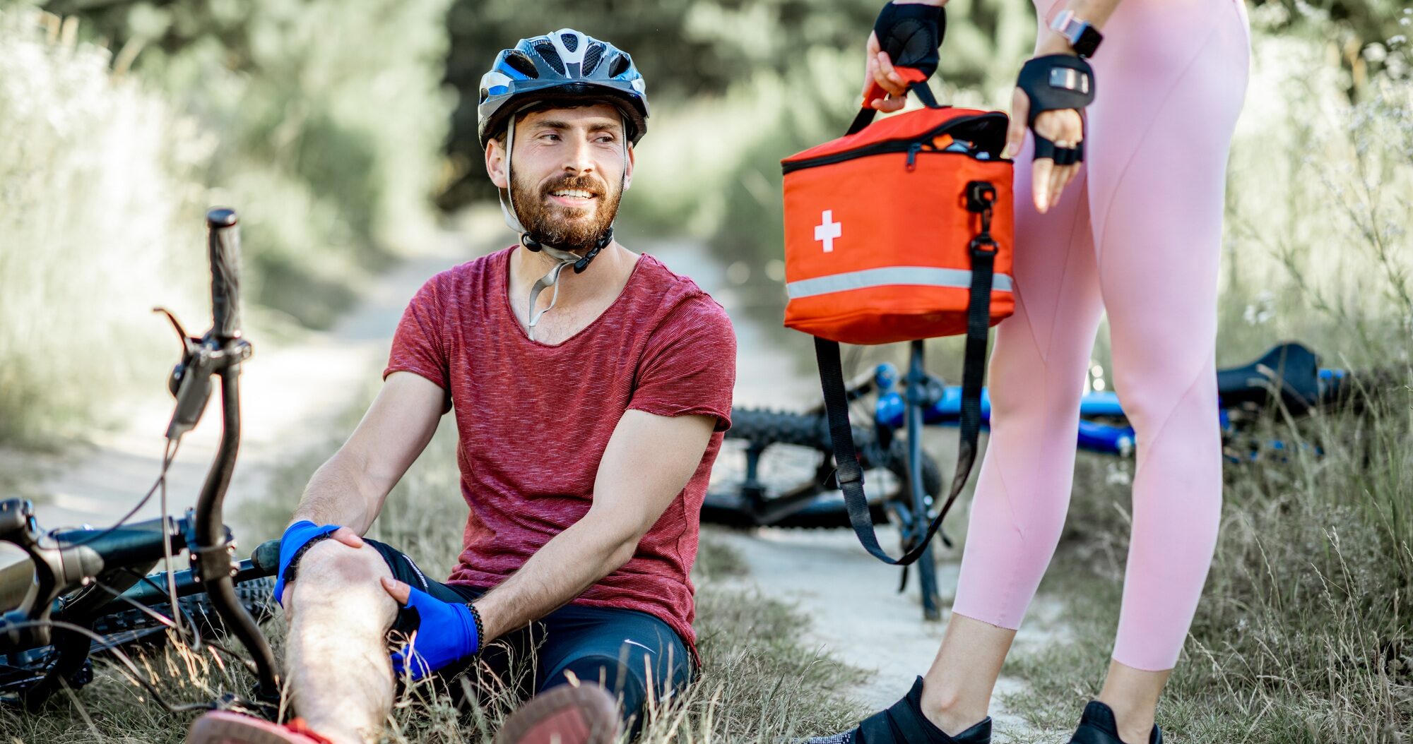 Man having injury while cycling outdoors